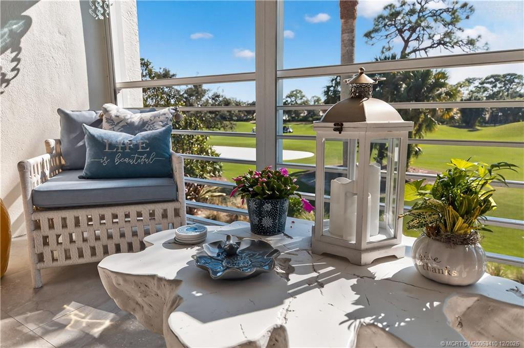 12445 Harbour Ridge Boulevard, Unit 38 Palm City, FL 34990 - Photo 12 of 46 a view of living room with furniture and flowers