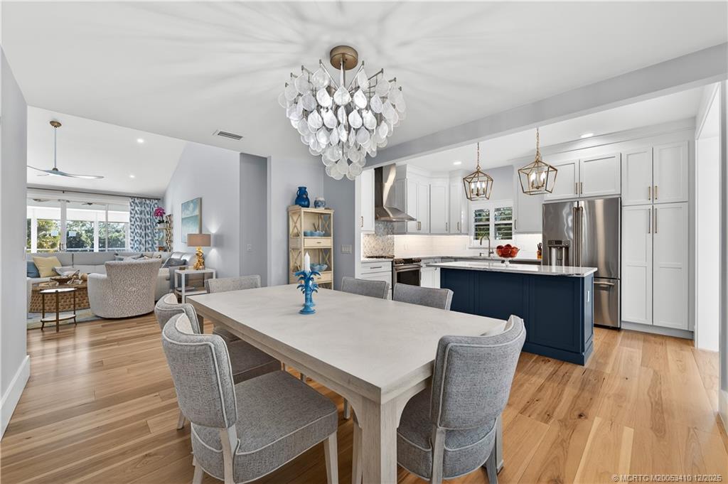 12445 Harbour Ridge Boulevard, Unit 38 Palm City, FL 34990 - Photo 14 of 46 a view of a dining room with furniture window and wooden floor
