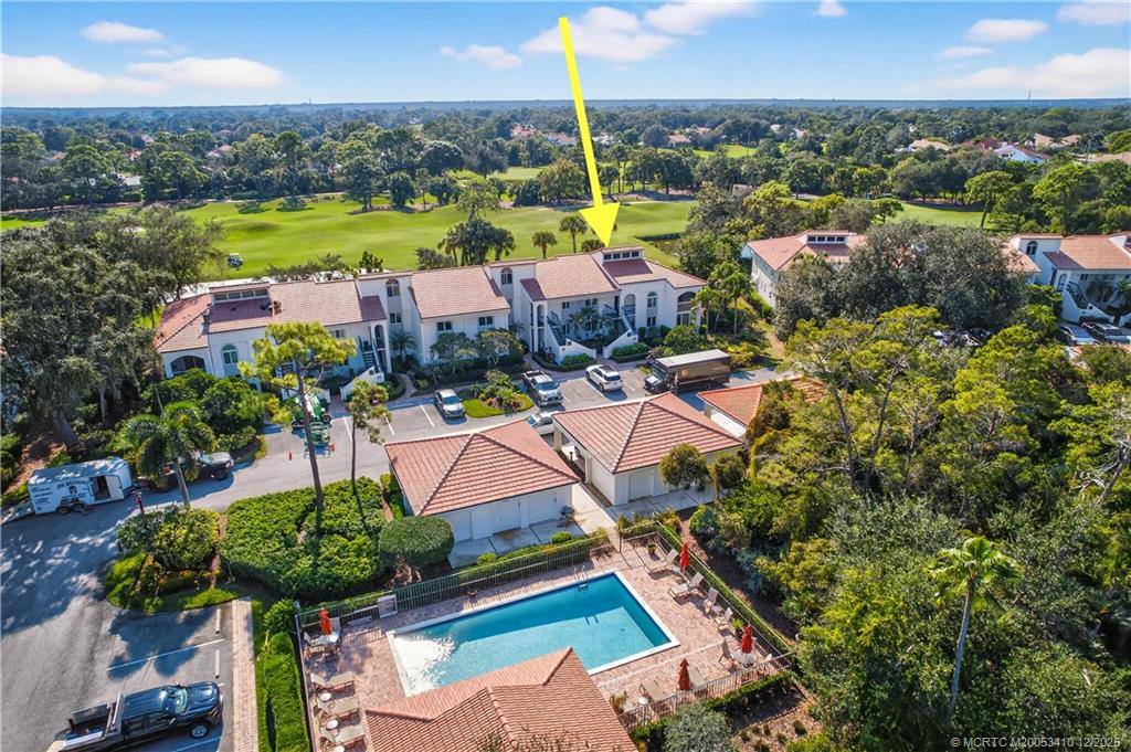 12445 Harbour Ridge Boulevard, Unit 38 Palm City, FL 34990 - Photo 2 of 46 an aerial view of residential houses with outdoor space and swimming pool