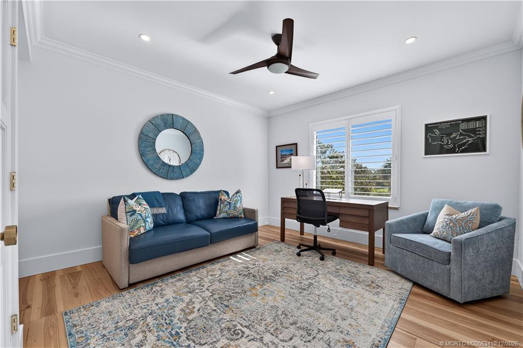 12445 Harbour Ridge Boulevard, Unit 38 Palm City, FL 34990 - Photo 28 of 46 a living room with couches rug and a large window