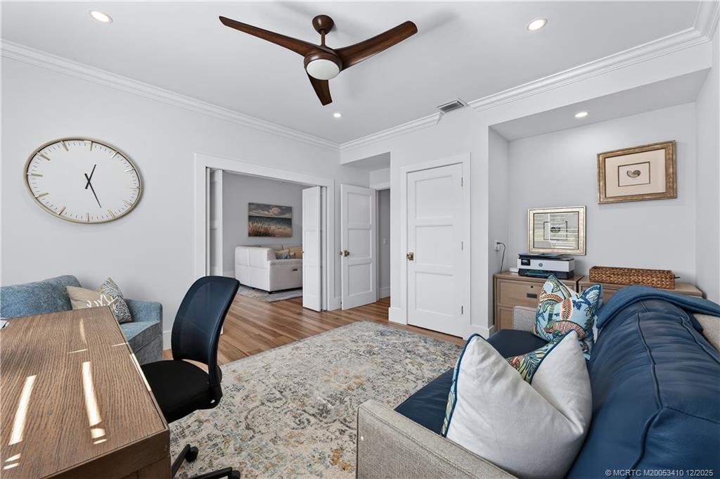 12445 Harbour Ridge Boulevard, Unit 38 Palm City, FL 34990 - Photo 29 of 46 a living room with furniture and a view of kitchen
