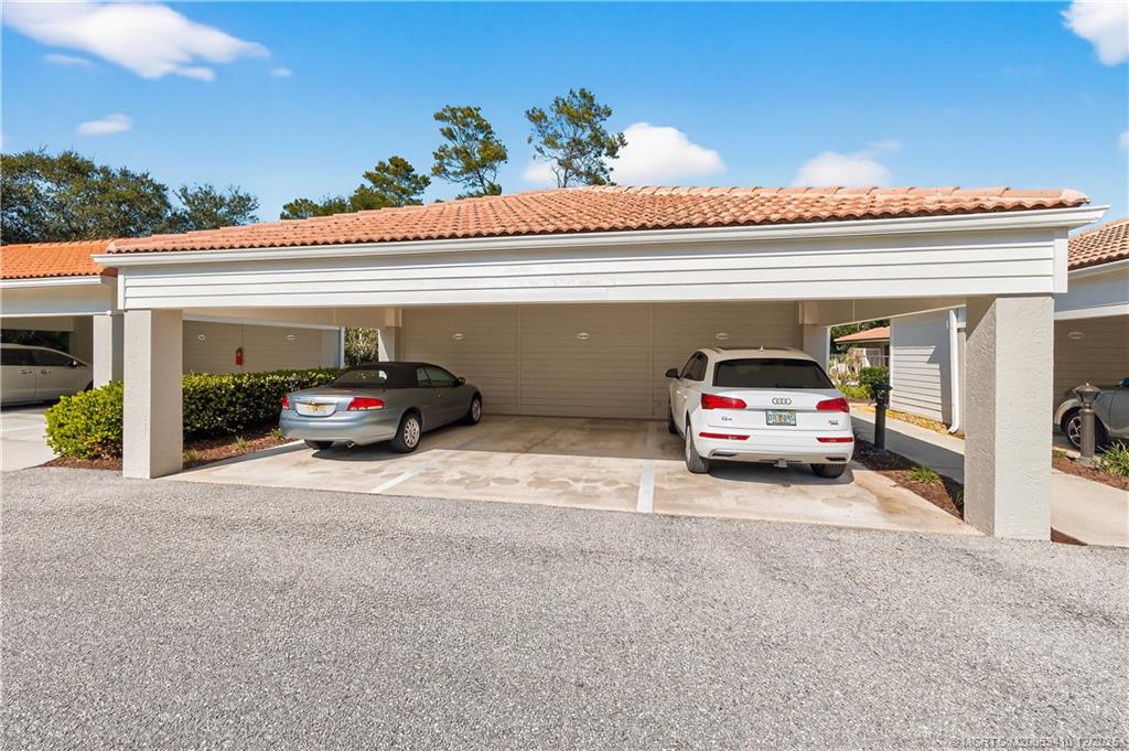 12445 Harbour Ridge Boulevard, Unit 38 Palm City, FL 34990 - Photo 33 of 46 a view of a car parked in garage