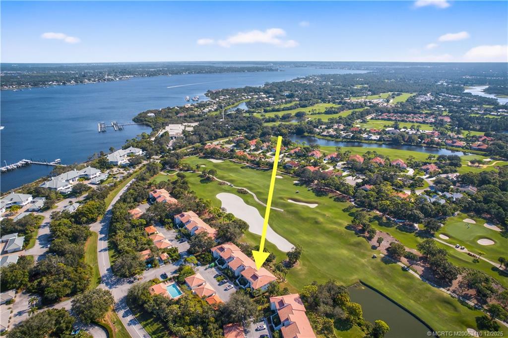 12445 Harbour Ridge Boulevard, Unit 38 Palm City, FL 34990 - Photo 34 of 46 an aerial view of lake and residential houses with outdoor space