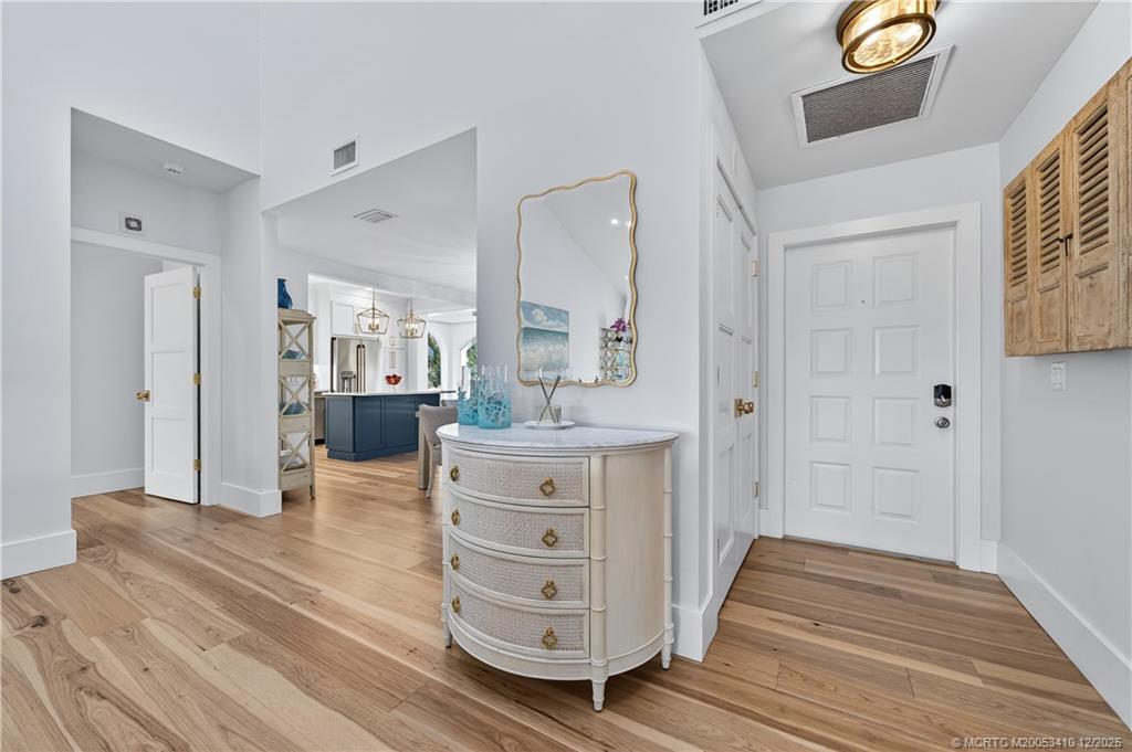 12445 Harbour Ridge Boulevard, Unit 38 Palm City, FL 34990 - Photo 4 of 46 a view of hotel room with wooden floor