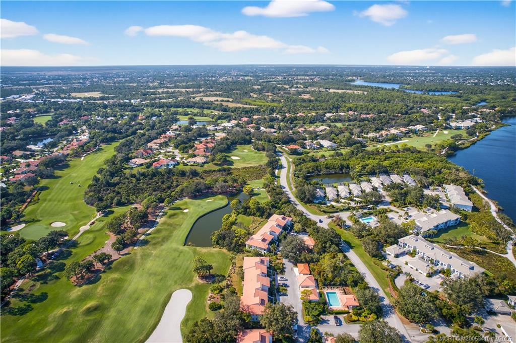 12445 Harbour Ridge Boulevard, Unit 38 Palm City, FL 34990 - Photo 43 of 46 an aerial view of residential houses with outdoor space