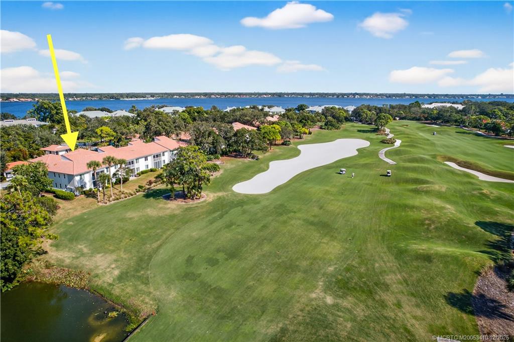 12445 Harbour Ridge Boulevard, Unit 38 Palm City, FL 34990 - Photo 45 of 46 a view of a lake with a big yard