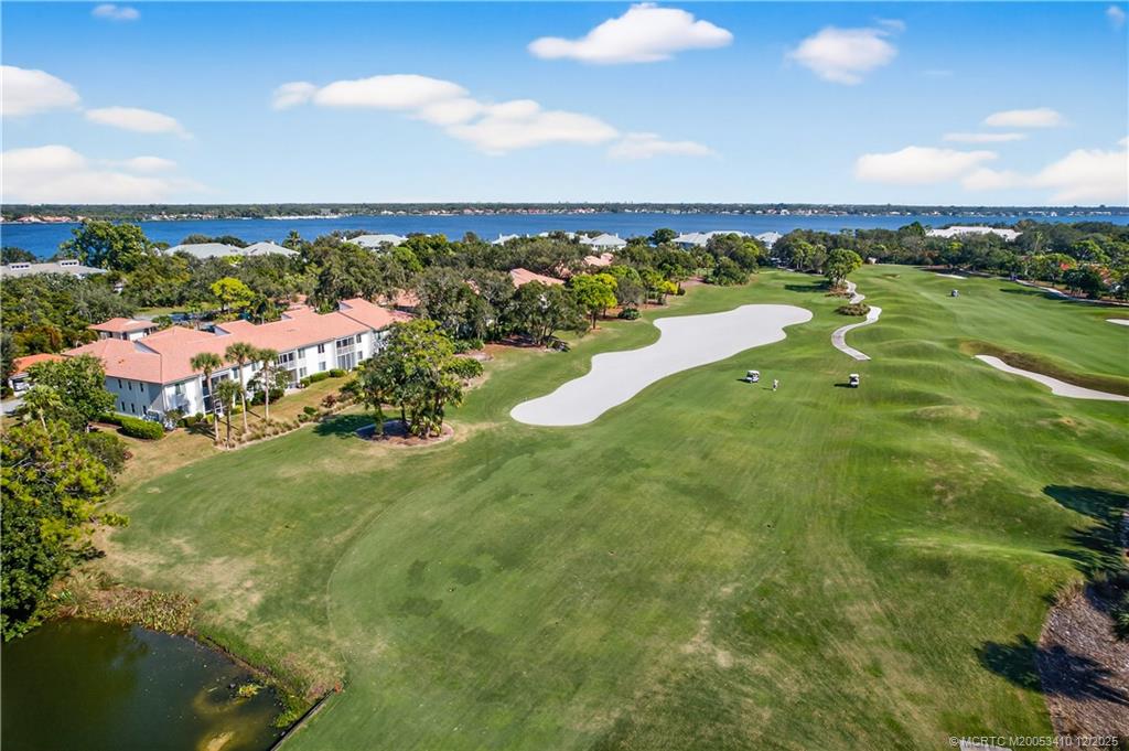 12445 Harbour Ridge Boulevard, Unit 38 Palm City, FL 34990 - Photo 46 of 46 a view of a lake with a city