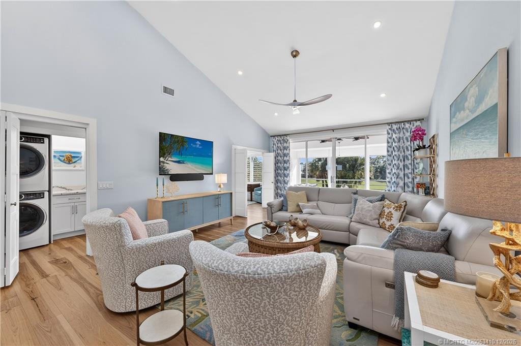 12445 Harbour Ridge Boulevard, Unit 38 Palm City, FL 34990 - Photo 6 of 46 a living room with furniture and a flat screen tv
