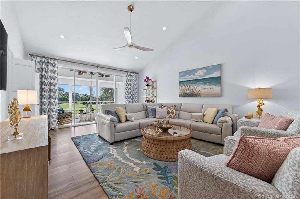 12445 Harbour Ridge Boulevard, Unit 38 Palm City, FL 34990 - Photo 7 of 46 a living room with furniture and a large window