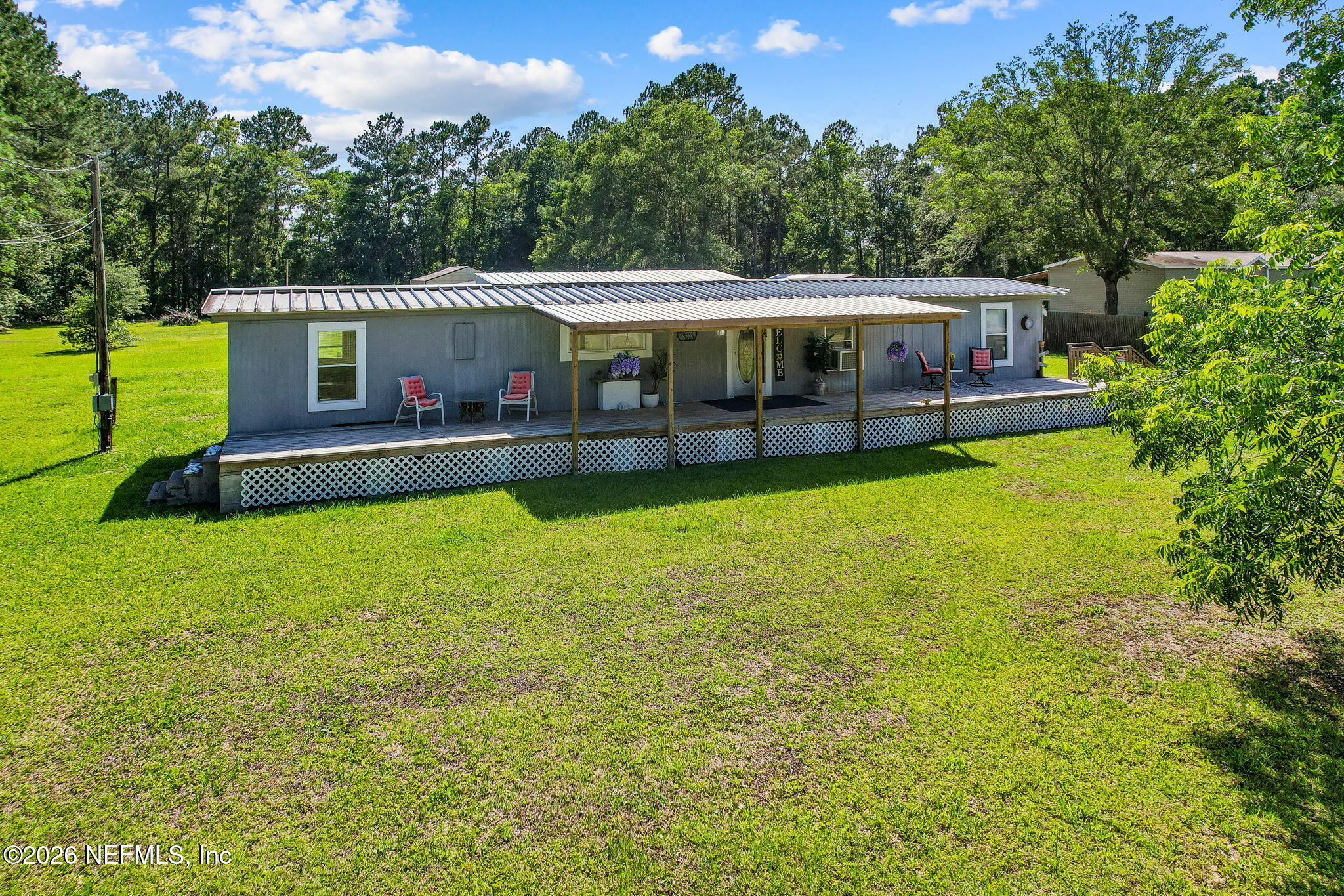 15690 Sears Road Jacksonville, FL 32218 - Photo 2 of 27 a view of a house with a yard