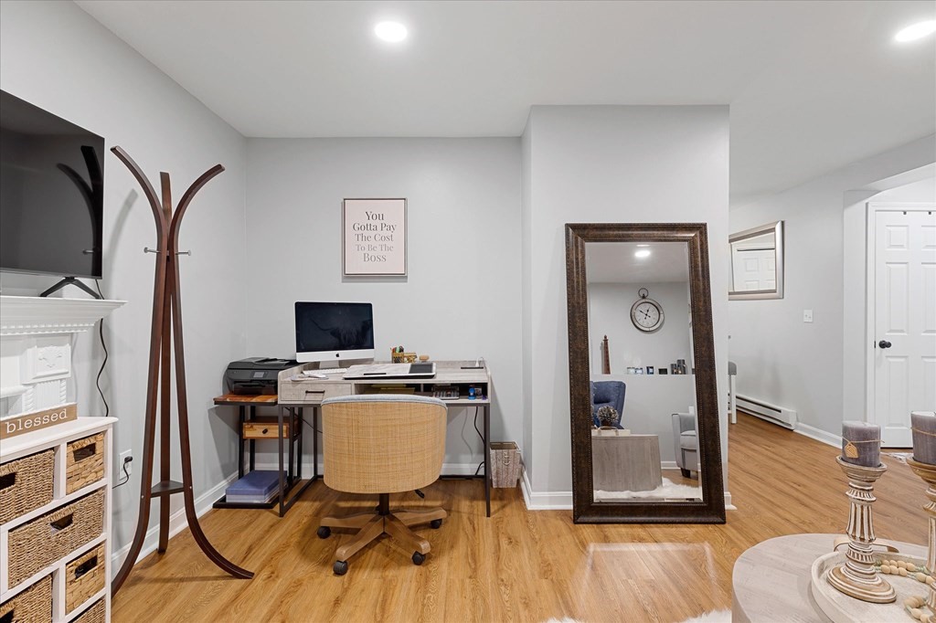 46 Gibbs Street, Unit 1D Worcester, MA 01607 - Photo 12 of 17 a workspace with furniture and wooden floor