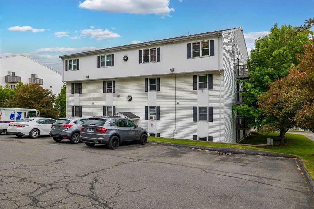 46 Gibbs Street, Unit 1D Worcester, MA 01607 - Photo 2 of 17 a car parked in front of a white house