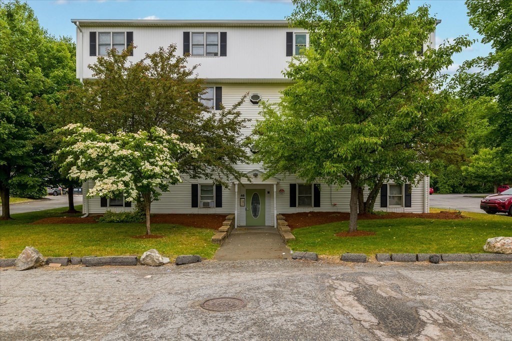 46 Gibbs Street, Unit 1D Worcester, MA 01607 - Photo 3 of 17 a view of a house with a yard