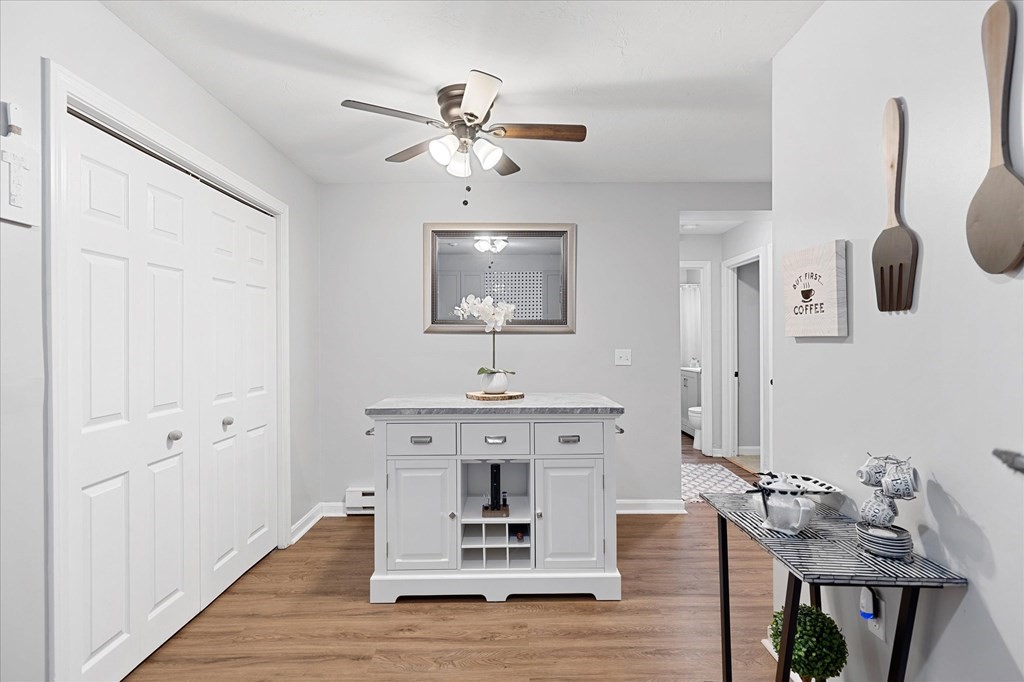 46 Gibbs Street, Unit 1D Worcester, MA 01607 - Photo 8 of 17 a living room with furniture and wooden floor