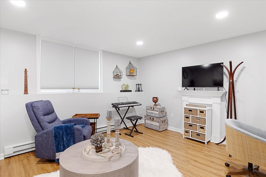 46 Gibbs Street, Unit 1D Worcester, MA 01607 - Photo 10 of 17 a living room with furniture and a flat screen tv