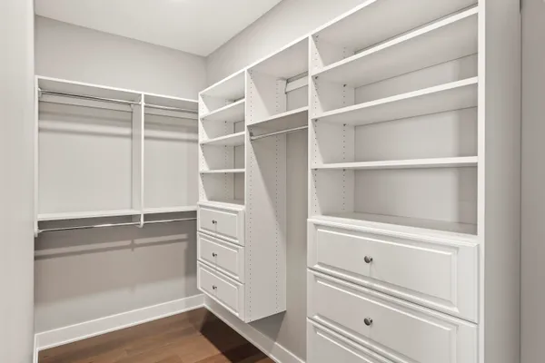 a bathroom with a double vanity sink toilet and shower