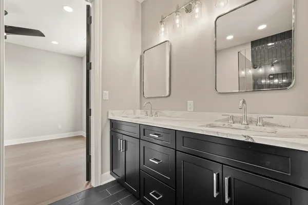 an empty room with closet and a chandelier fan