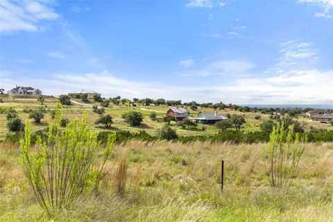 a view of lake with green space