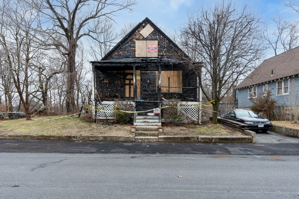111 Schiller Road Dedham, MA 02026 - Photo 6 of 10 a front view of a house with garden