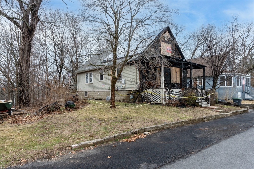 111 Schiller Road Dedham, MA 02026 - Photo 7 of 10 a house that has a tree in front of it