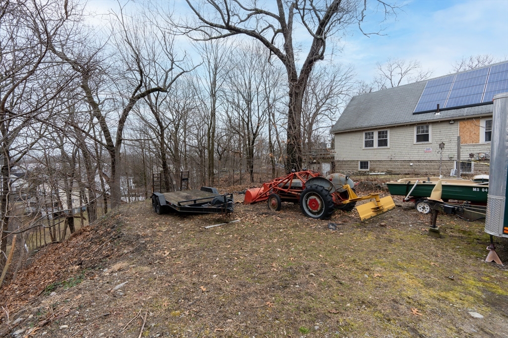 111 Schiller Road Dedham, MA 02026 - Photo 9 of 10 a view of a car is parked in front of a house
