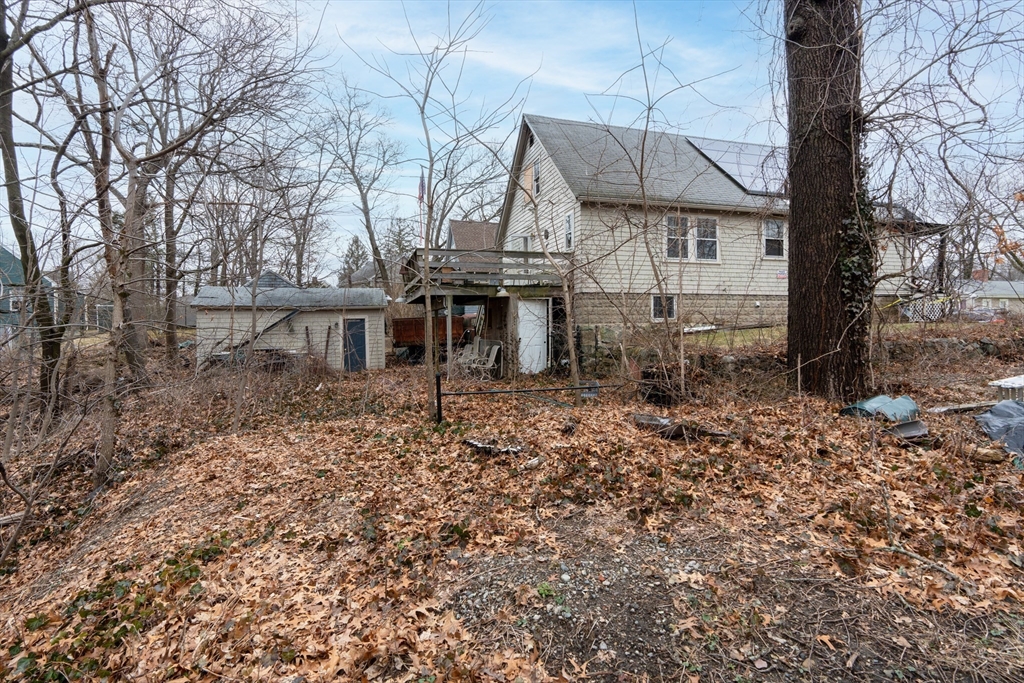 111 Schiller Road Dedham, MA 02026 - Photo 10 of 10 a backyard of a house with lots of green space