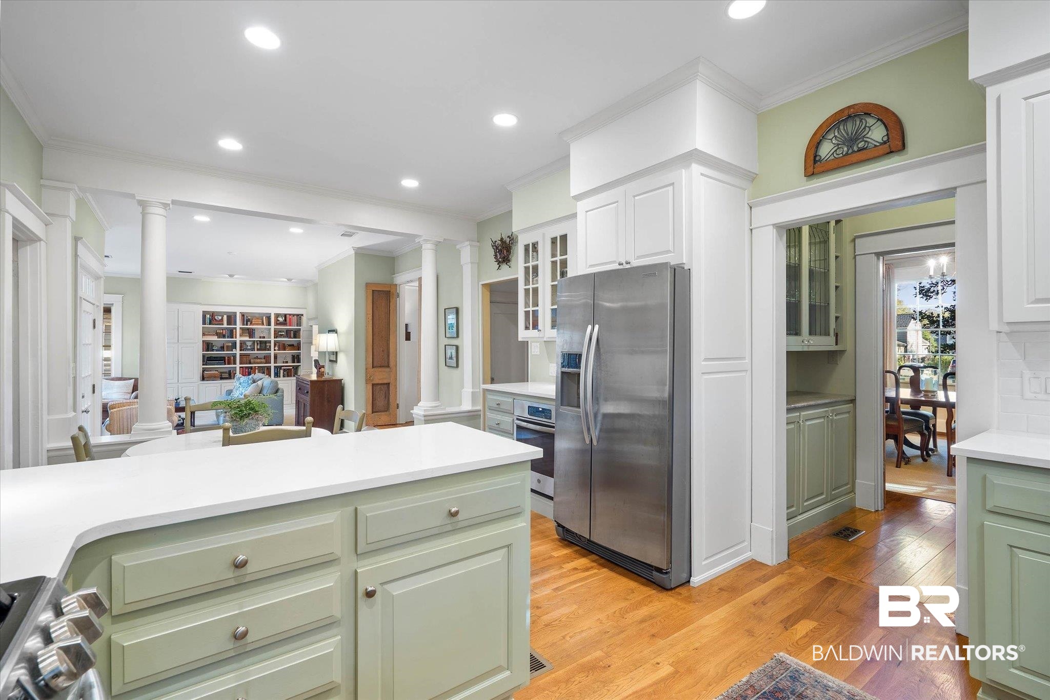 2 Westgate Road Mobile, AL 36608 - Photo 15 of 63 Kitchen featuring ornamental molding, stainless steel appliances, decorative columns, glass fronted cabinets, and recessed lighting