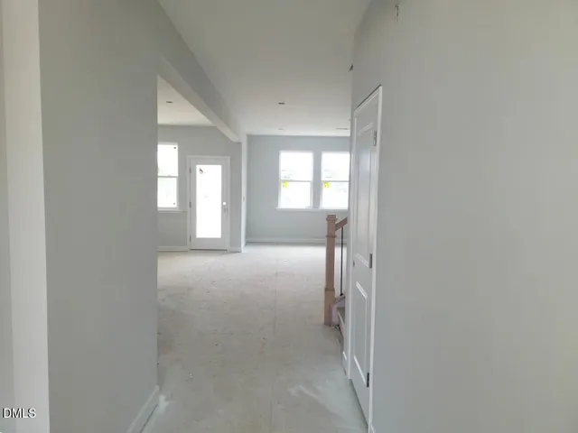 a view of empty room with a fireplace