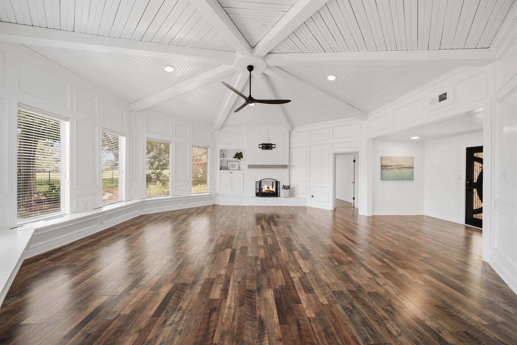 79 Summers Wind Street Conroe, TX 77356 - Photo 6 of 45 a view of an empty room with window and wooden floor
