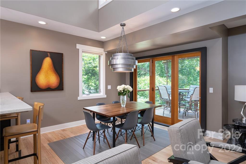 9 Kenilworth Road Asheville, NC 28803 - Photo 12 of 33 a dining room with furniture a chandelier and wooden floor