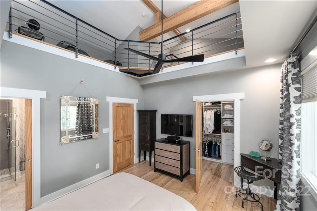 9 Kenilworth Road Asheville, NC 28803 - Photo 17 of 33 a bedroom with furniture and large window