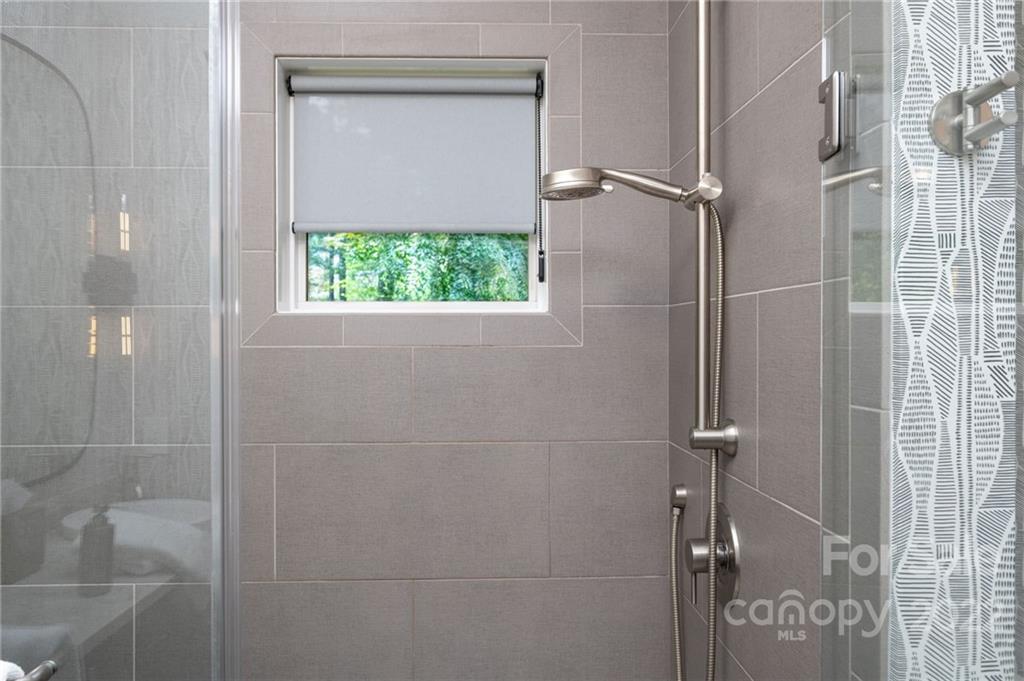 9 Kenilworth Road Asheville, NC 28803 - Photo 20 of 33 a bathroom with a glass shower door