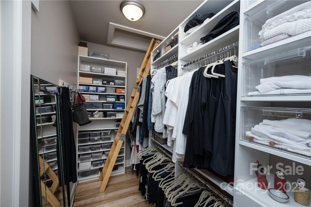 9 Kenilworth Road Asheville, NC 28803 - Photo 21 of 33 a view of walk in closet with clothes and shoes