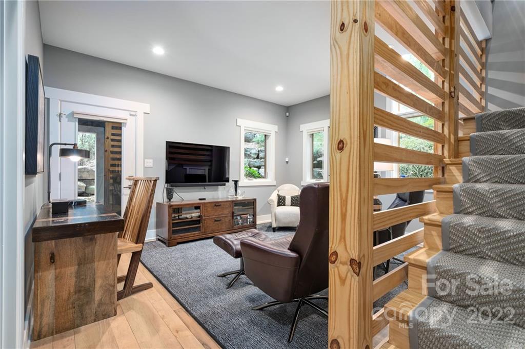 9 Kenilworth Road Asheville, NC 28803 - Photo 24 of 33 a living room with furniture and a flat screen tv