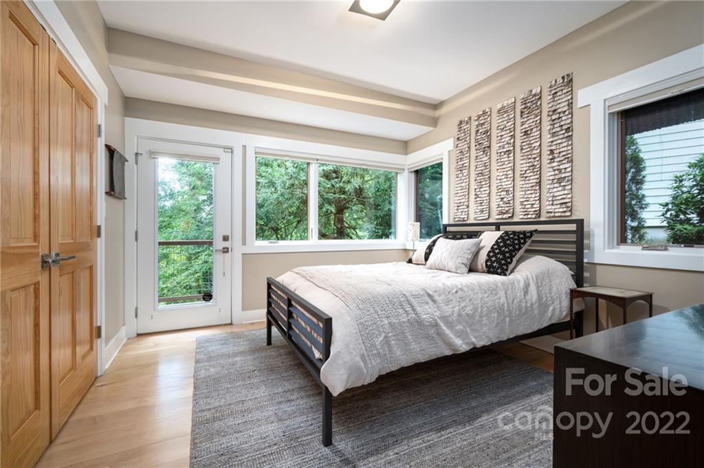9 Kenilworth Road Asheville, NC 28803 - Photo 27 of 33 a bedroom with a bed and a large window