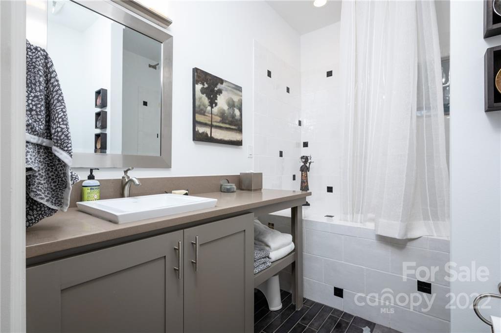 9 Kenilworth Road Asheville, NC 28803 - Photo 29 of 33 a bathroom with a sink and a mirror