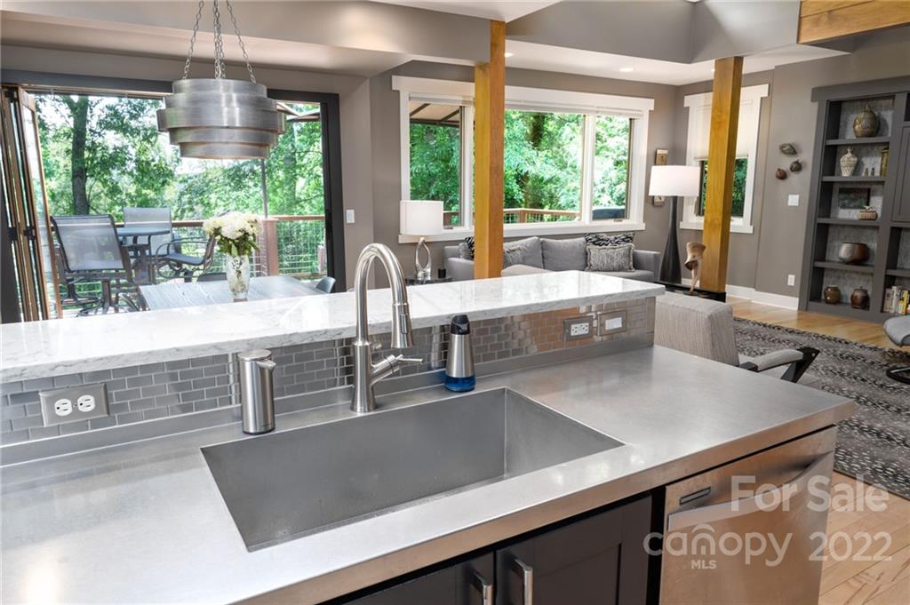 9 Kenilworth Road Asheville, NC 28803 - Photo 9 of 33 a kitchen with kitchen island a large window in it