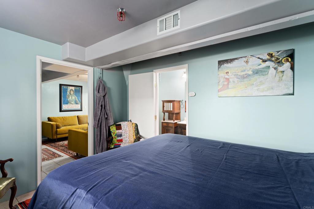 25770 East Grade Road Santa Ysabel, CA 92070 - Photo 35 of 75 a bedroom with a bed and a large mirror on the dresser