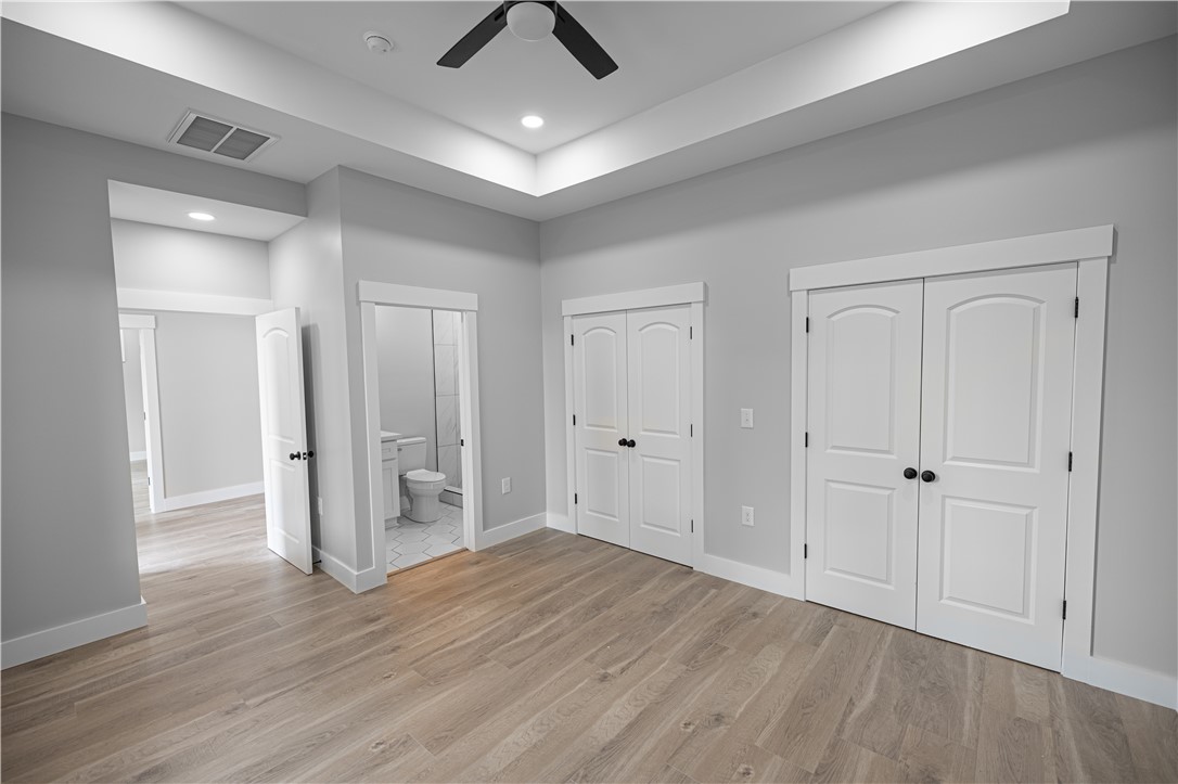2817 Broadway Lake Road Anderson, SC 29621 - Photo 22 of 41 Recessed lighting illuminates this room, complemented by a contemporary ceiling fan and light wood flooring.