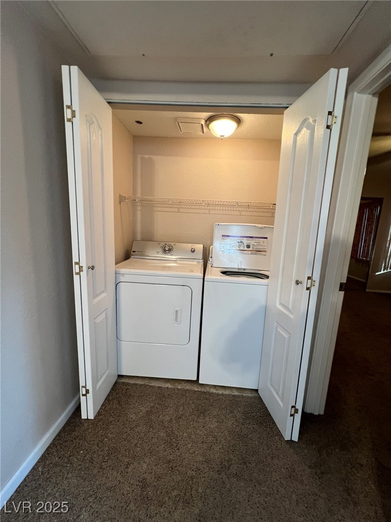 9325 West Desert Inn Road, Unit 206 Las Vegas, NV 89117 - Photo 13 of 37 Washroom featuring washer and dryer and dark colored carpet