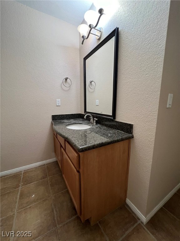 9325 West Desert Inn Road, Unit 206 Las Vegas, NV 89117 - Photo 21 of 37 Bathroom with a textured wall and vanity