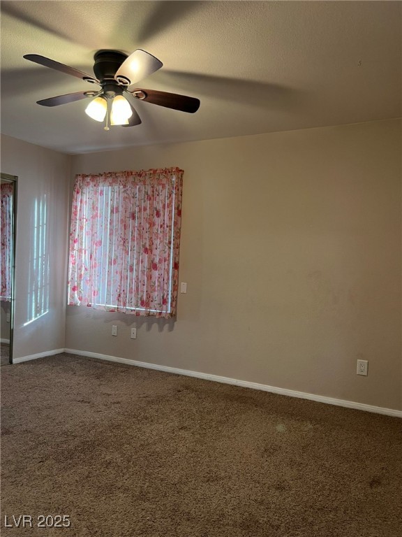 9325 West Desert Inn Road, Unit 206 Las Vegas, NV 89117 - Photo 9 of 37 Empty room with carpet, a ceiling fan, and a textured ceiling