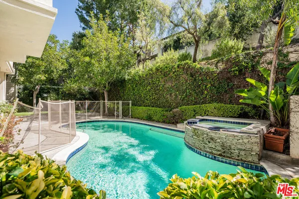 a view of a garden with swimming pool