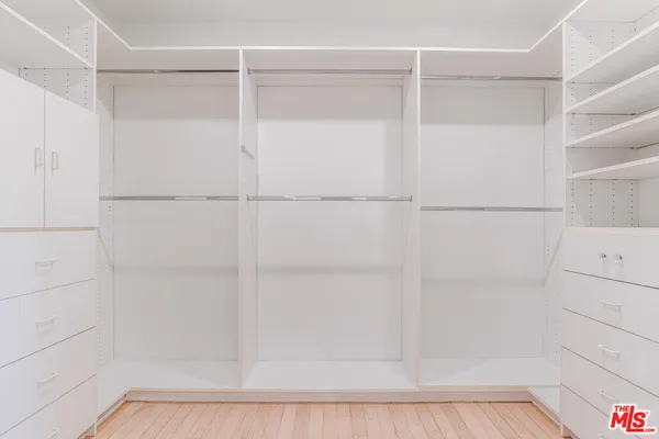 a bathroom with a sink a large mirror and a bathtub