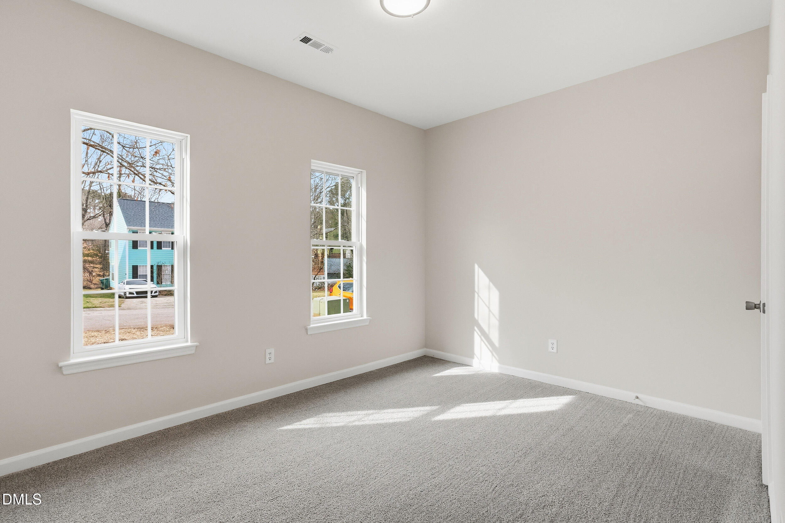 2020 Collier Road Durham, NC 27707 - Photo 15 of 32 a view of empty room with windows