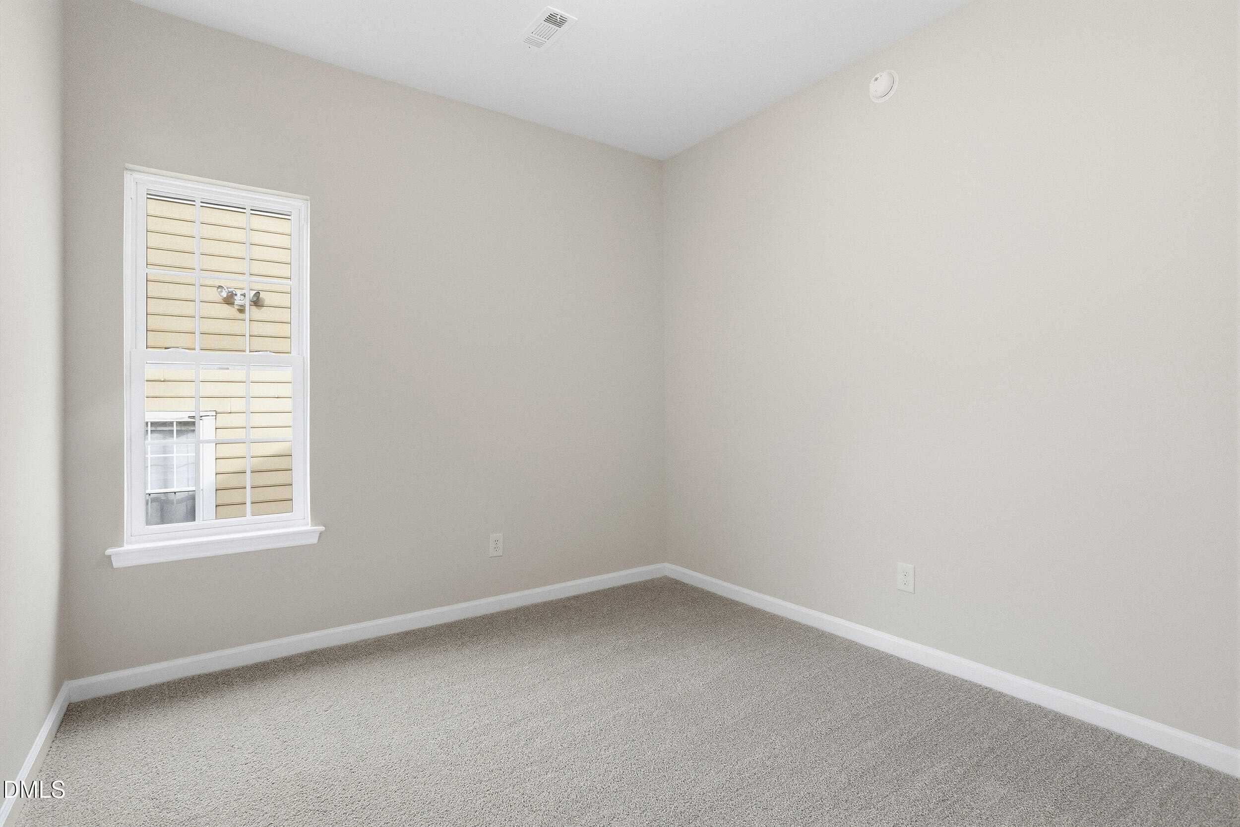 2020 Collier Road Durham, NC 27707 - Photo 16 of 32 an empty room with a window