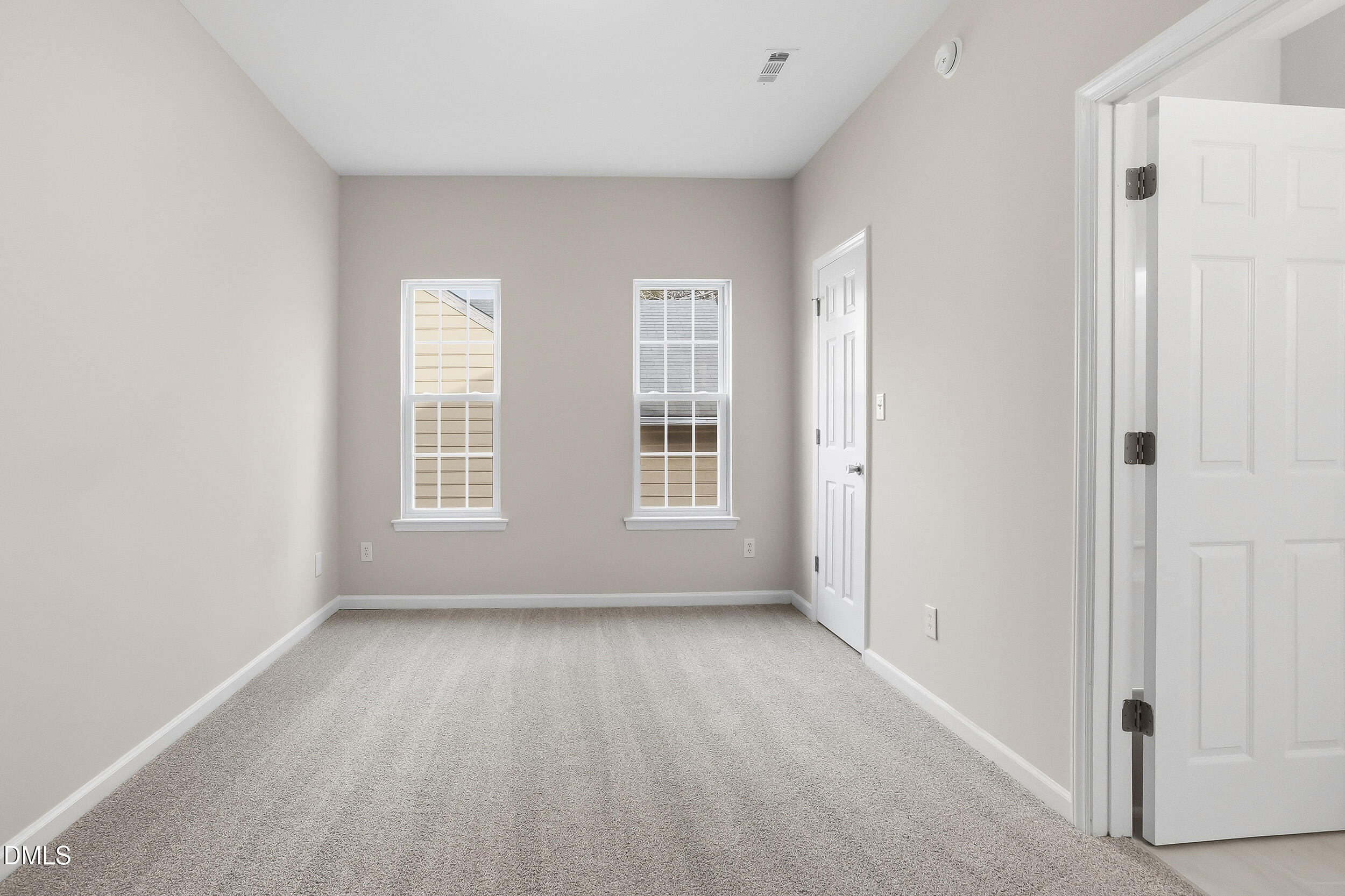2020 Collier Road Durham, NC 27707 - Photo 20 of 32 an empty room with windows