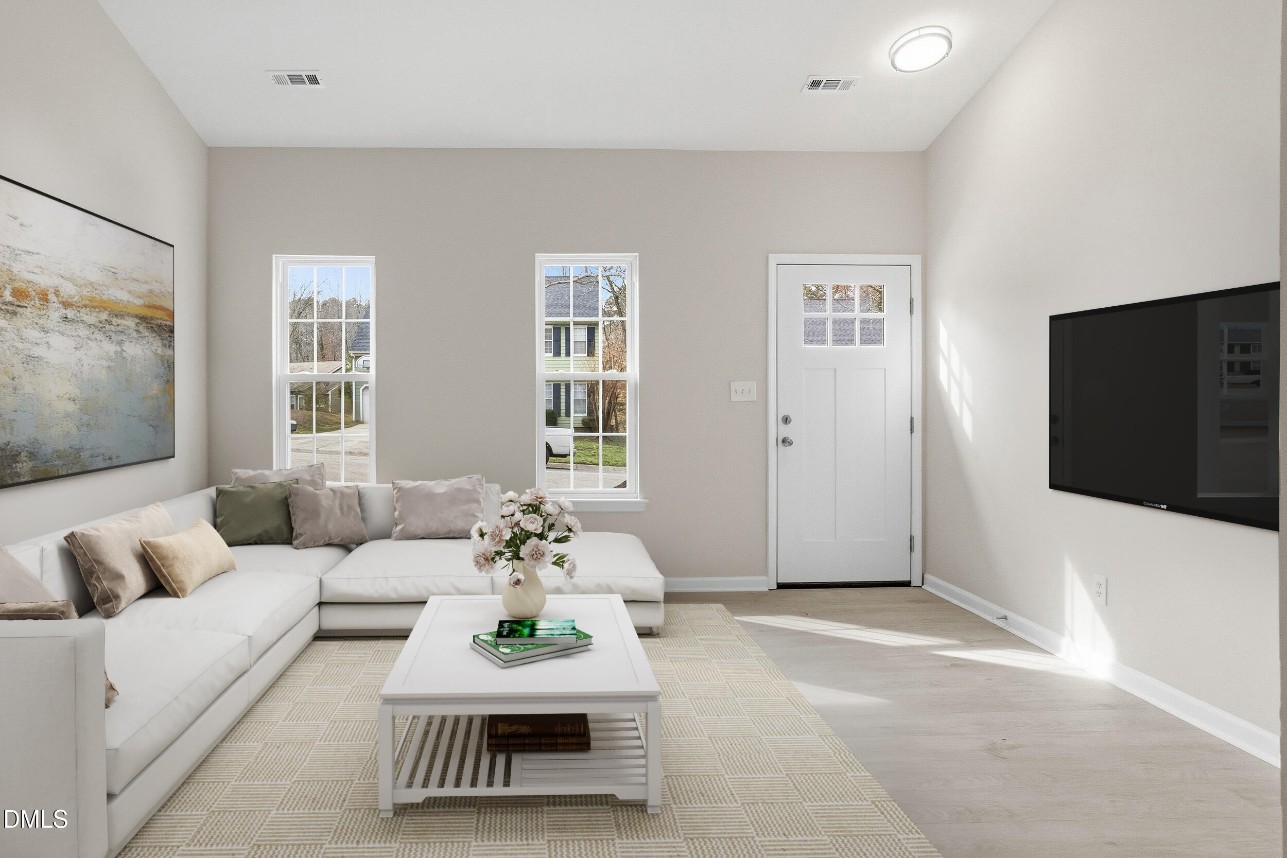 2020 Collier Road Durham, NC 27707 - Photo 3 of 32 a living room with furniture and a flat screen tv
