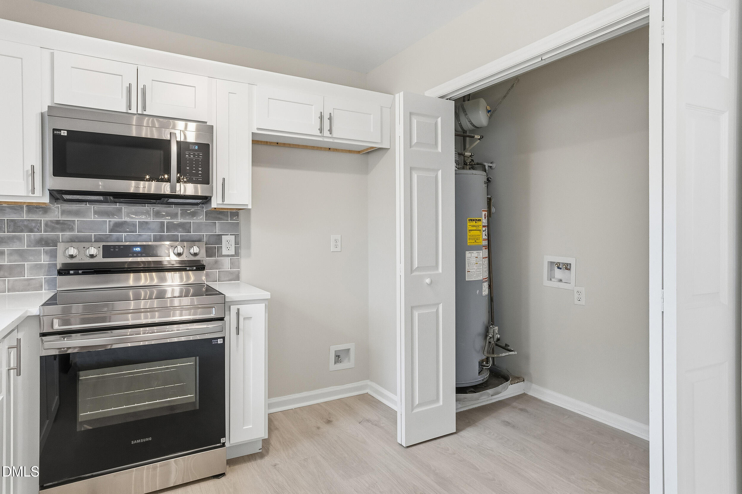 2020 Collier Road Durham, NC 27707 - Photo 10 of 32 a kitchen with a stove and a microwave