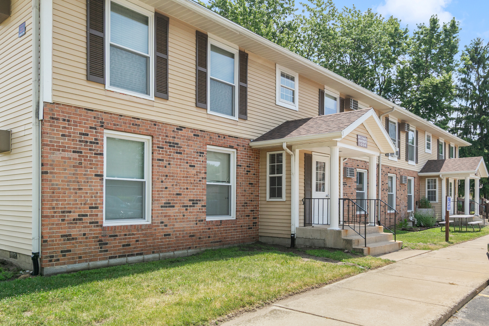 405 East Reed Street, Unit 9 Braidwood, IL 60408 - Photo 2 of 14 a view of a house with a yard